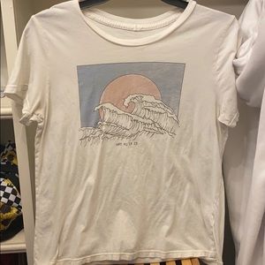 “AND SO IT IS” wave t-shirt.